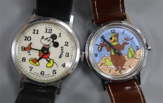 A base metal Bradley Mickey Mouse manual wind wrist watch and a Yogi bear wrist watch.